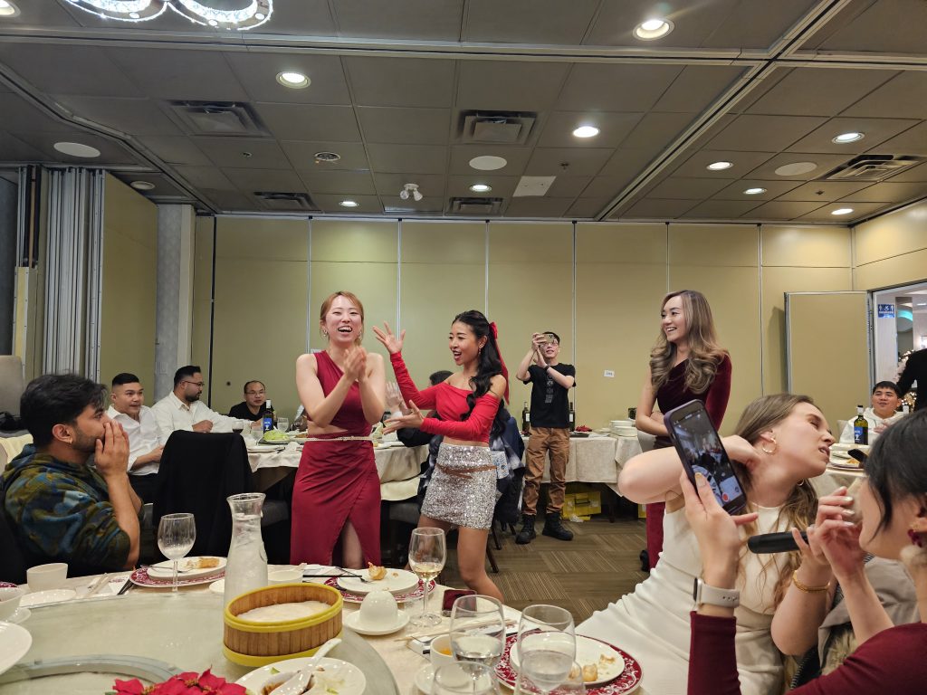 Team members dancing and cheering during the 2023 party