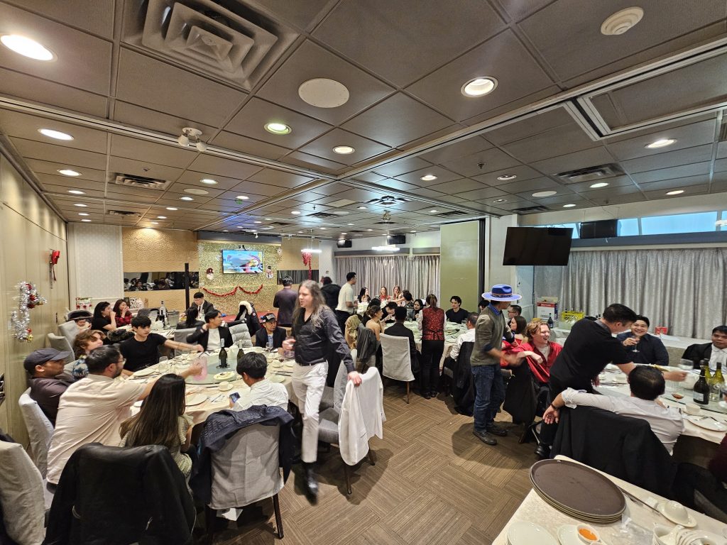 The banquet room full of tables at the 2025 Christmas party