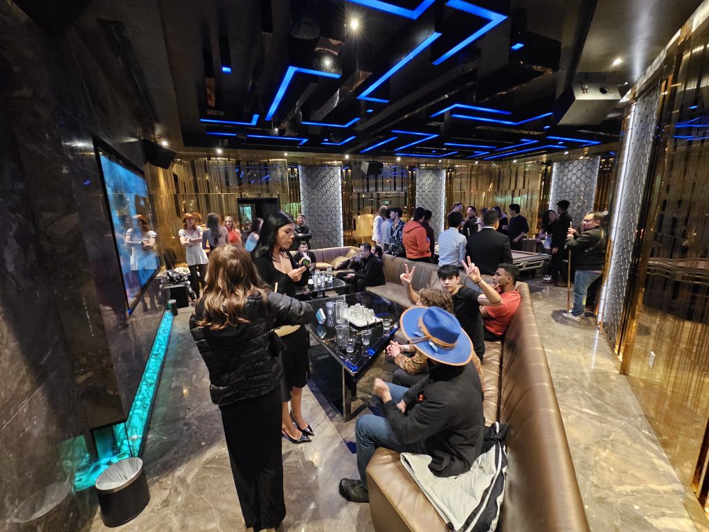 The team relaxing in the karaoke lounge after dinner