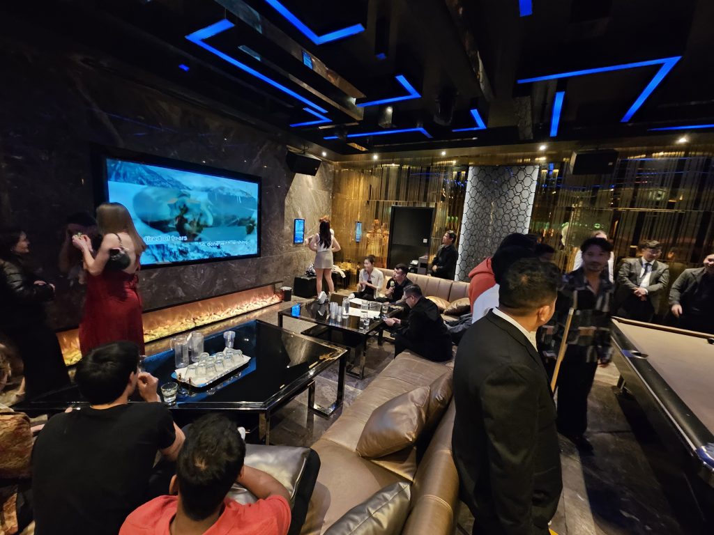 Karaoke and conversation in the after-party lounge