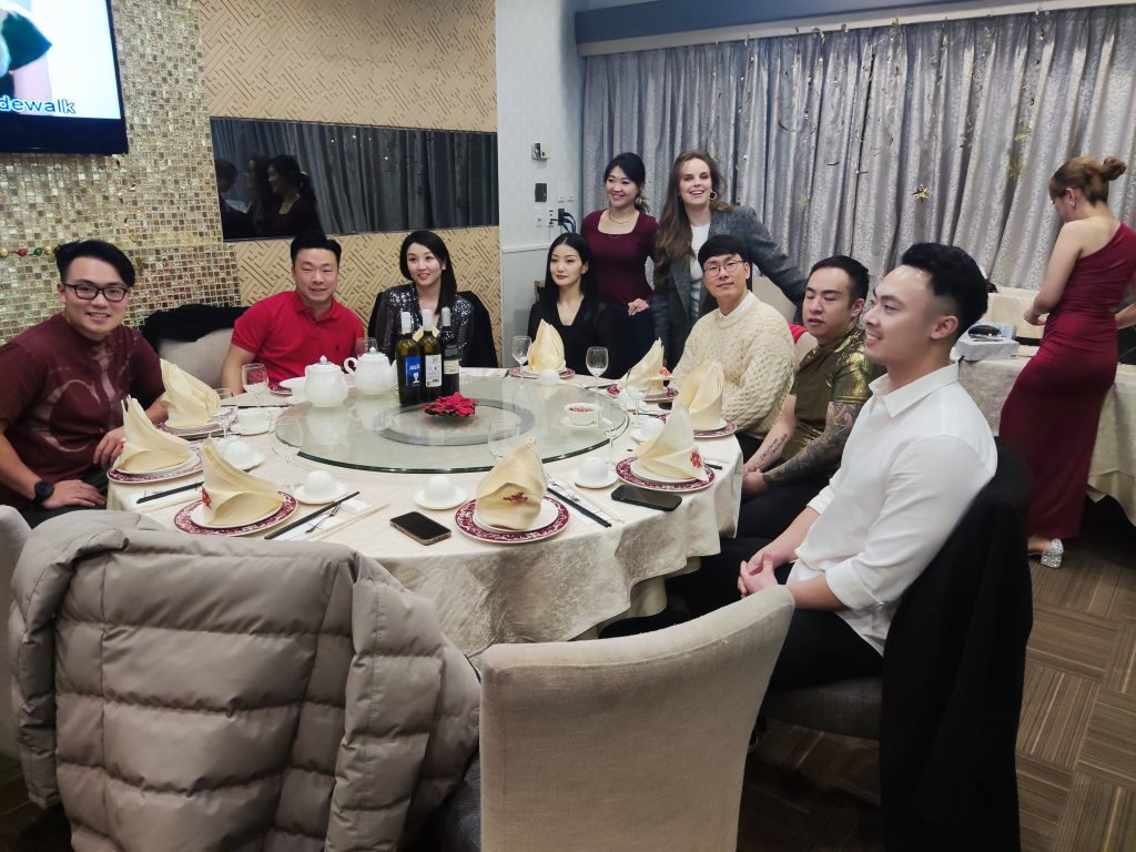 Team members gathered around a dinner table