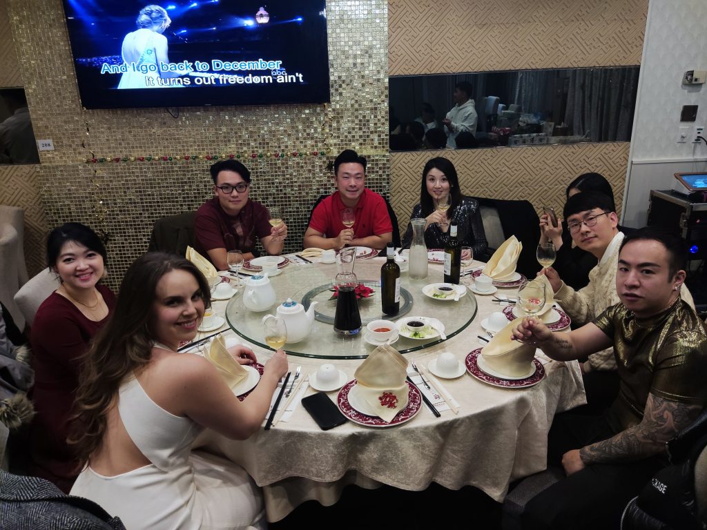 A table of team members raising a toast